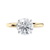 Lab grown solitaire diamond engagement ring with thin band yellow gold front view.