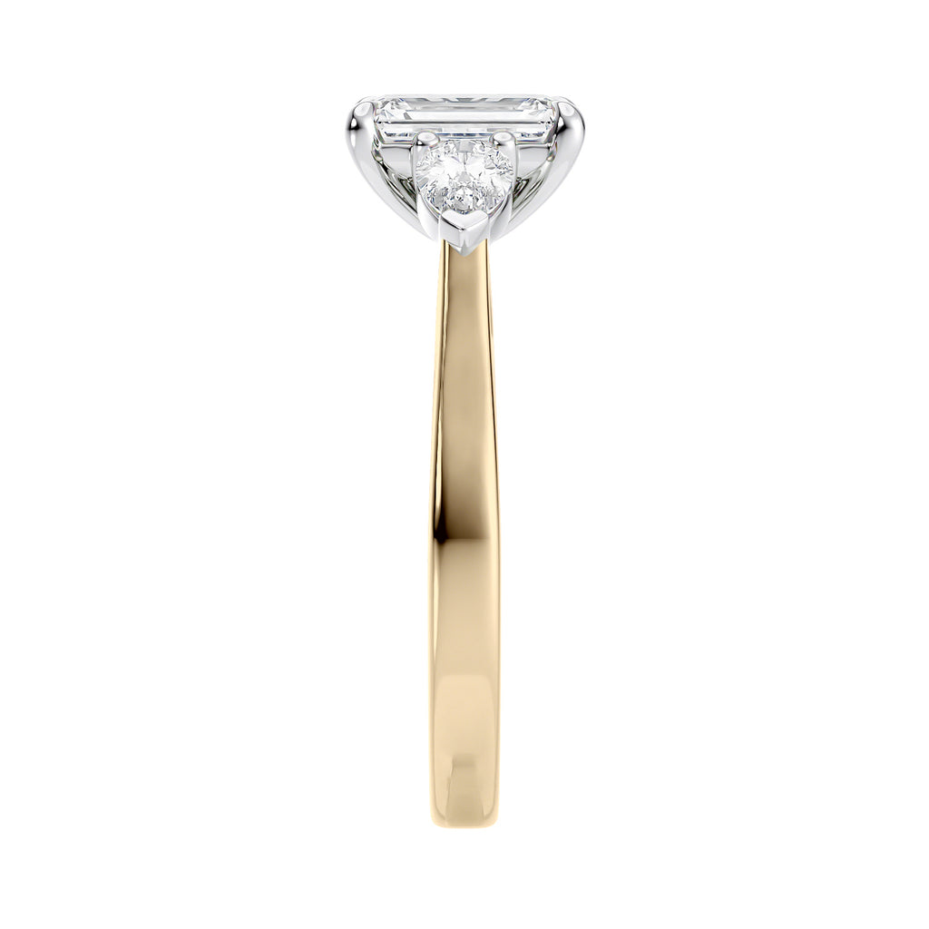 Emerald cut diamond engagement ring with pear cut sides 18ct gold end view.
