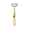 Emerald cut diamond engagement ring with pear cut sides 18ct gold end view.