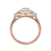 Emerald cut diamond engagement ring with pear cut sides 18ct rose gold side view.