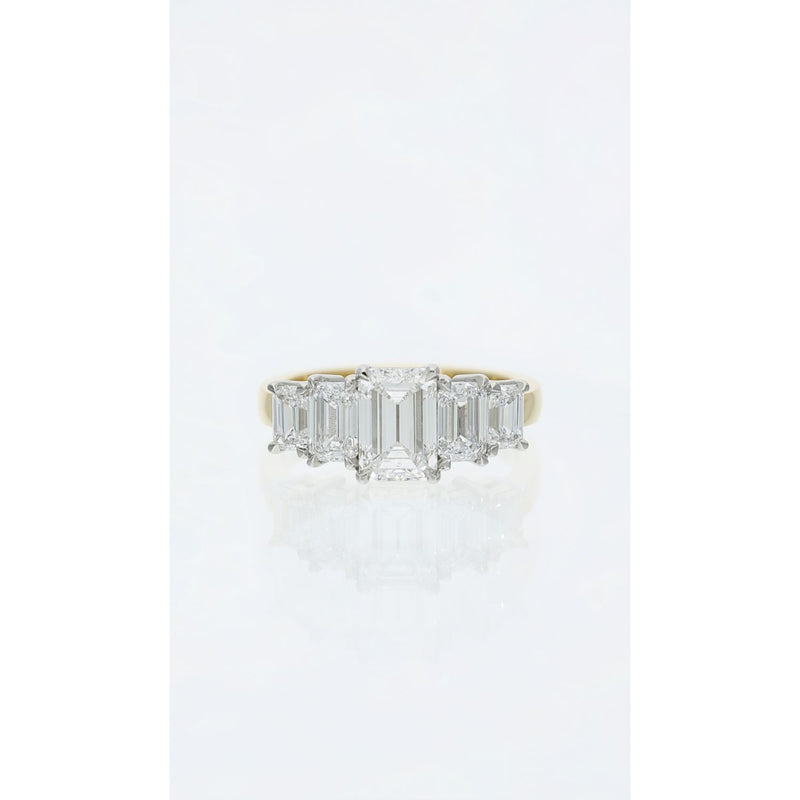 emerald cut diamond eternity ring in platinum and yellow gold