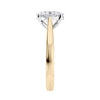 Lab grown oval cut diamond engagement ring with tapered band gold end view.