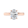 Lab grown oval cut diamond engagement ring with tapered band rose gold front view.