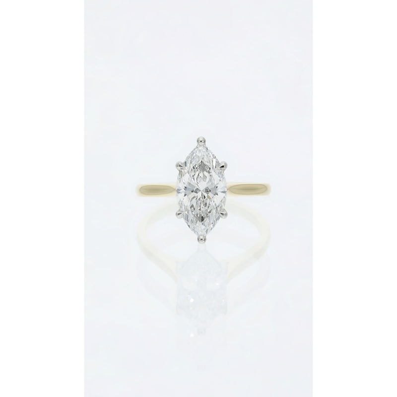 Marquise cut diamond solitaire ring in platinum and gold