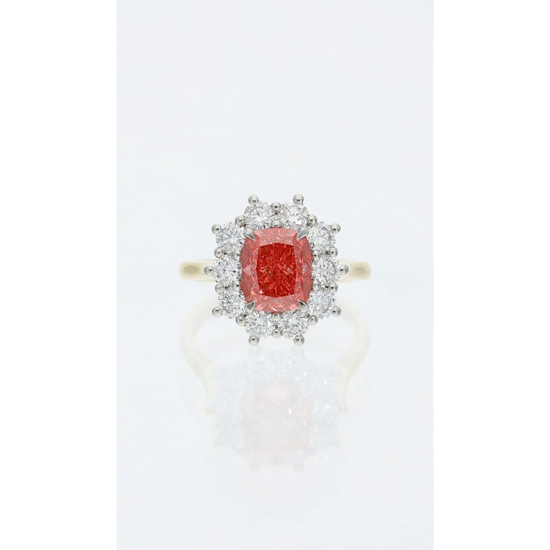 Fancy vivid pink cushion cut diamond cluster ring in gold and platinum