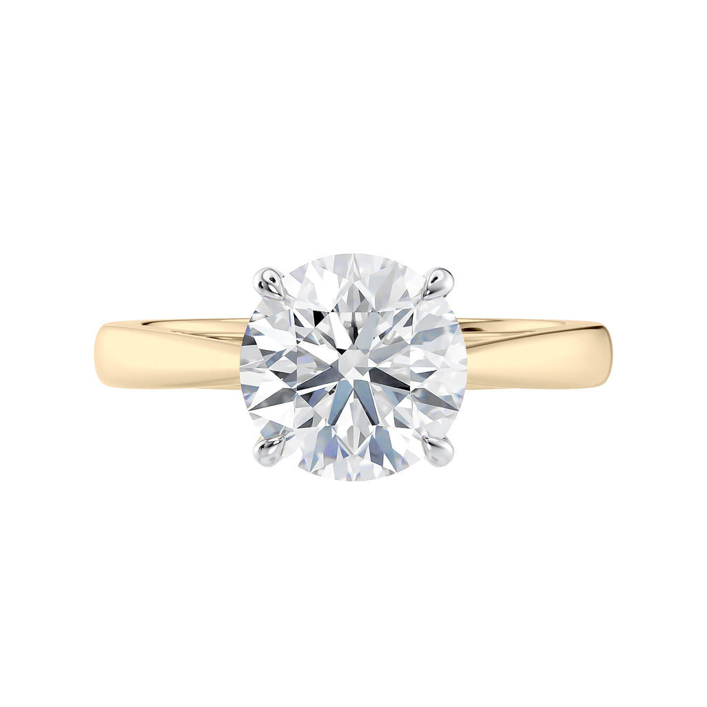 Round cut diamond solitaire engagement ring gold front view.