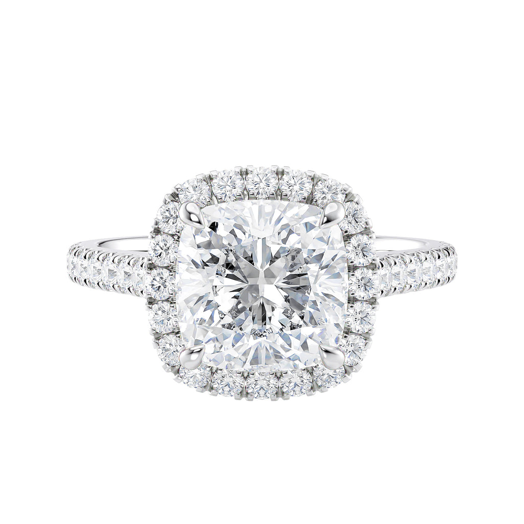 Cushion cut diamond halo style engagement ring white gold front view.