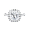 Cushion cut diamond halo style engagement ring white gold front view.