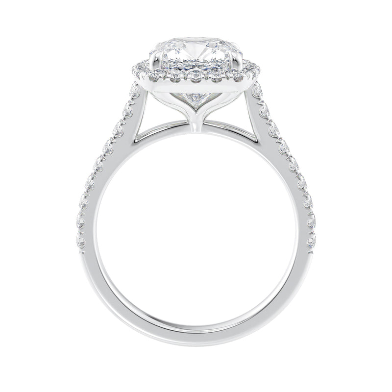 Cushion cut diamond halo style engagement ring white gold side view.
