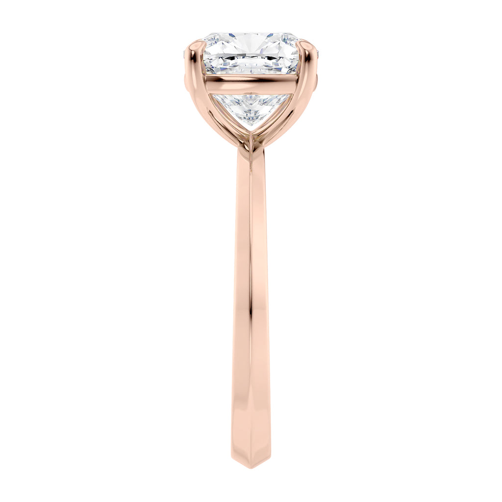Natural cushion cut diamond solitaire engagement ring rose gold end view.