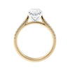 Natural oval cut engagement ring with tapered diamond gold band side view.