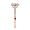 Natural oval cut engagement ring with tapered diamond rose gold band end view.
