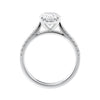 Natural oval cut engagement ring with tapered diamond white gold band side view.
