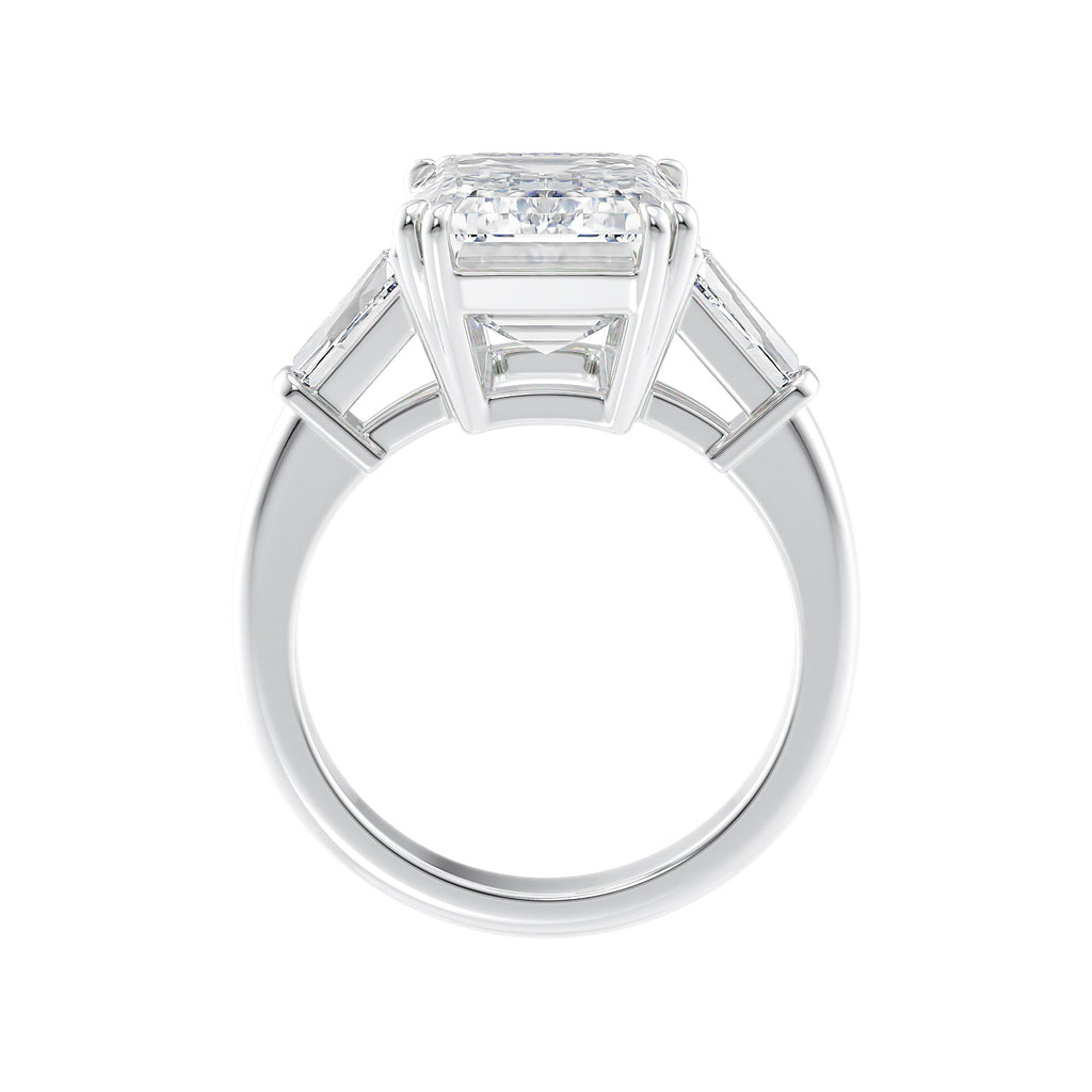 Emerald cut laboratory grown diamond engagement ring with tapered baguette shoulders white gold side view.