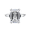 Emerald cut laboratory grown diamond engagement ring with tapered baguette shoulders white gold front view.