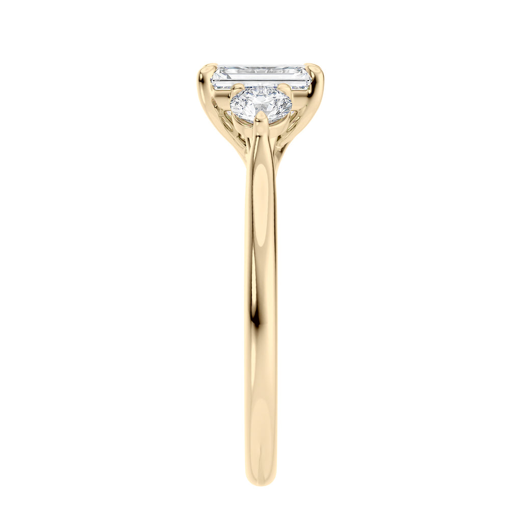 Emerald cut natural diamond 3 stone engagement ring 18ct gold end view.