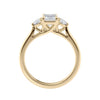 Emerald cut natural diamond 3 stone engagement ring 18ct gold side view.