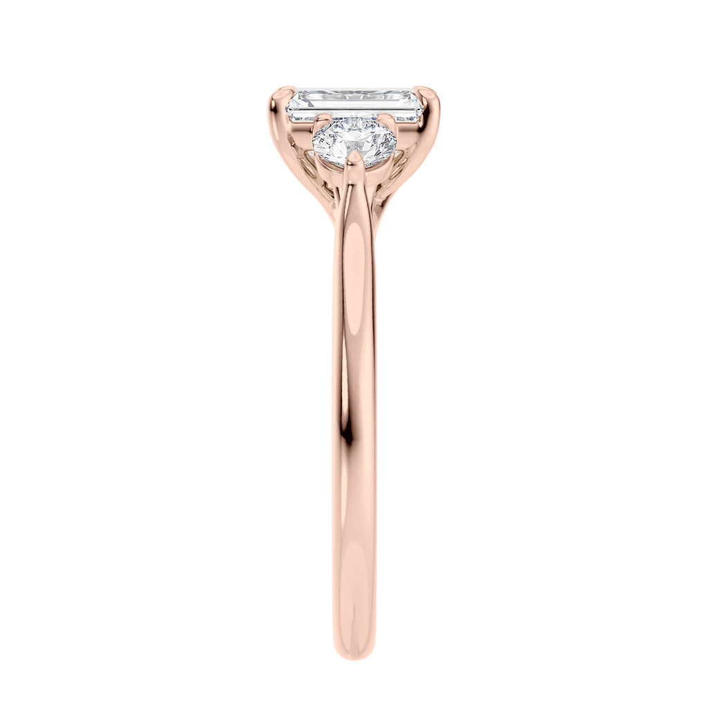 Emerald cut natural diamond 3 stone engagement ring 18ct rose gold end view.
