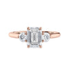 Emerald cut natural diamond 3 stone engagement ring 18ct rose gold front view.
