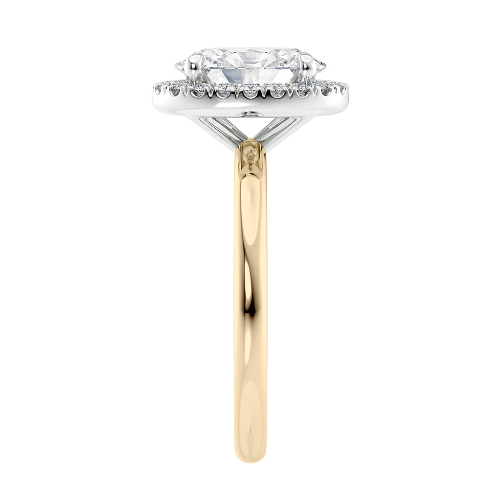 Oval halo diamond engagement ring in gold end view.