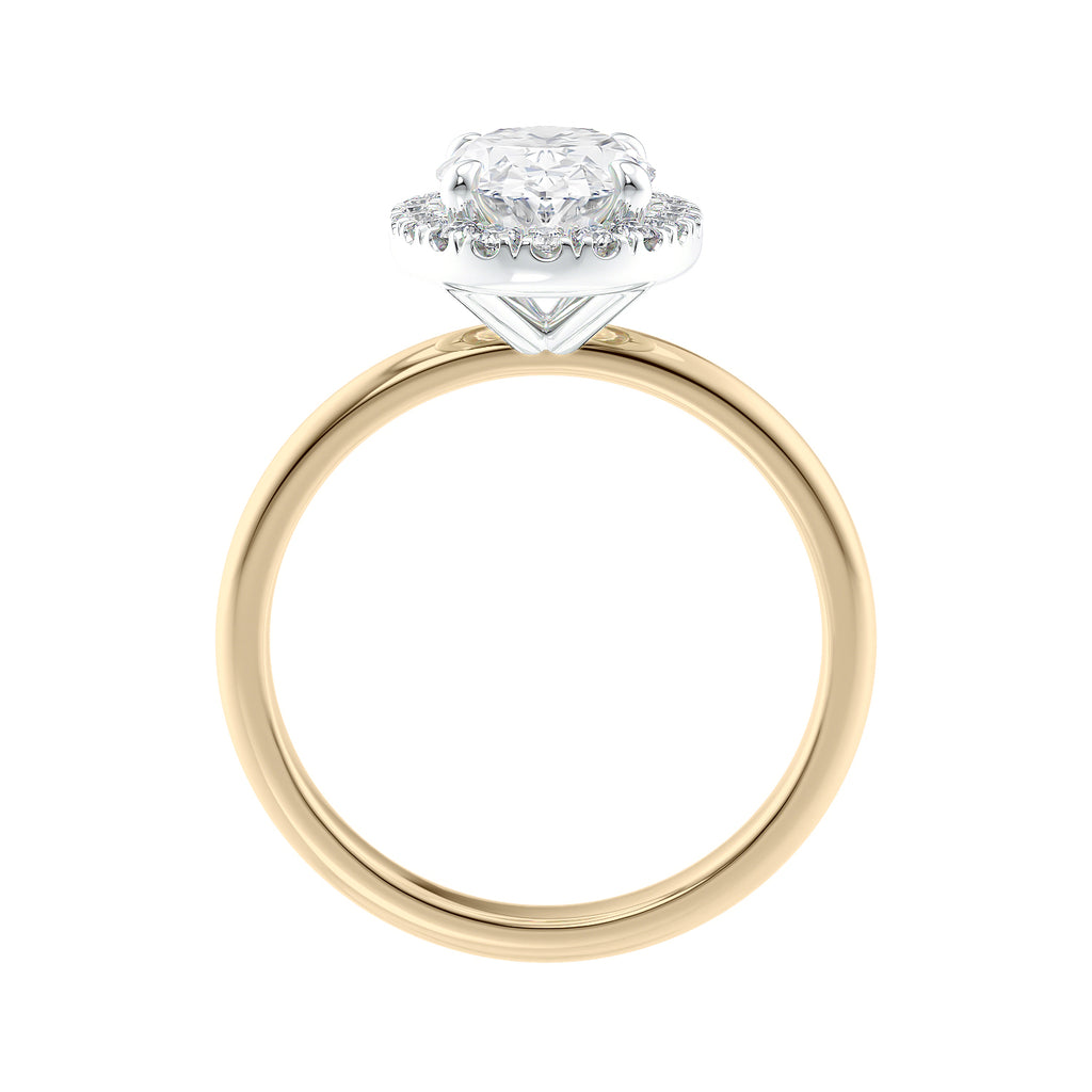 Oval halo diamond engagement ring in gold side view.