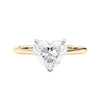 Laboratory grown heart cut diamond solitaire engagement ring with diamond set bridge 18ct gold front view.