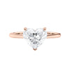 Laboratory grown heart cut diamond solitaire engagement ring with diamond set bridge 18ct rose gold front view.