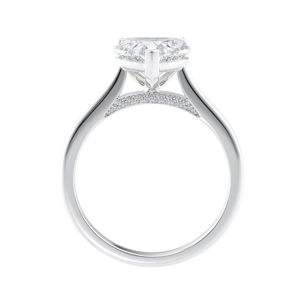 Laboratory grown heart cut diamond solitaire engagement ring with diamond set bridge white gold side view.