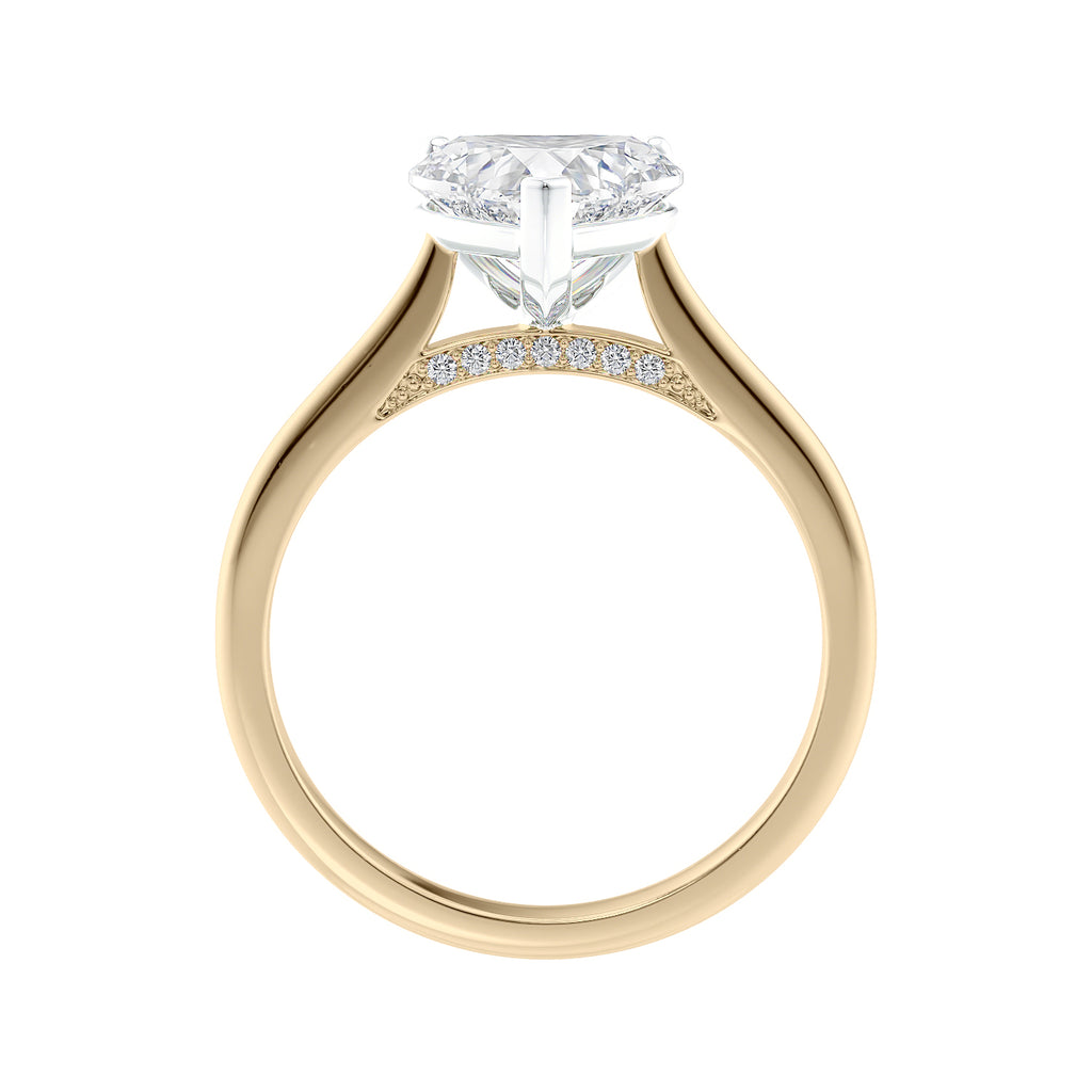 Heart shaped natural diamond engagement ring 18ct gold side view.