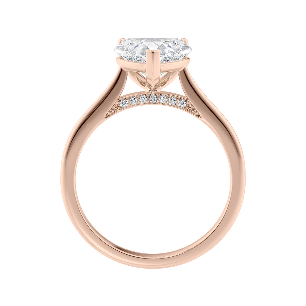 Heart shape natural diamond engagement ring 18ct rose gold side view.