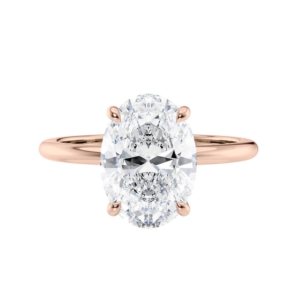 Hidden halo oval lab grown diamond engagement ring slim band rose gold front view.