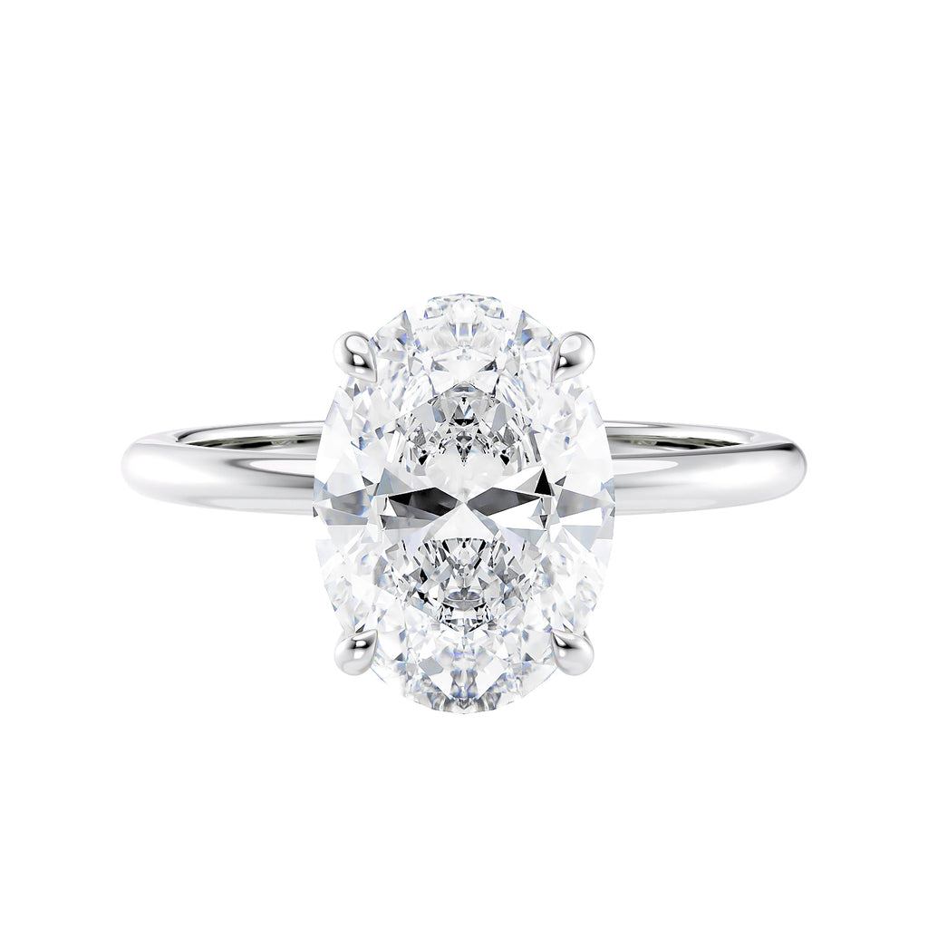 Hidden halo oval lab grown diamond engagement ring slim band white gold front view.