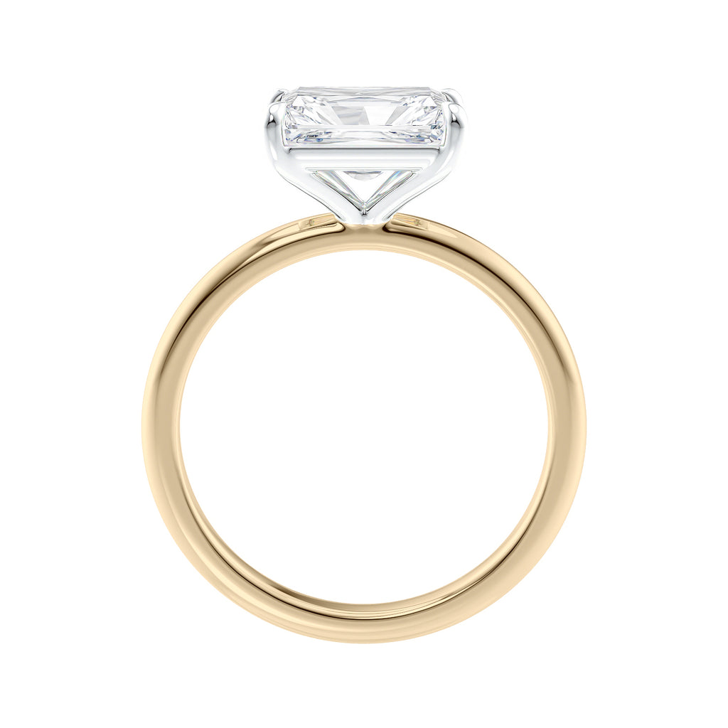 Radiant cut lab grown diamond east-west set on thin band gold side view.