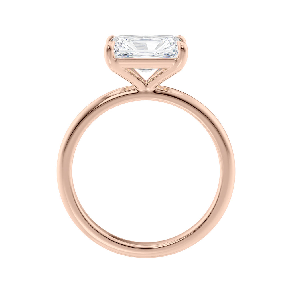 Radiant cut lab grown diamond east-west set on thin band rose gold side view.