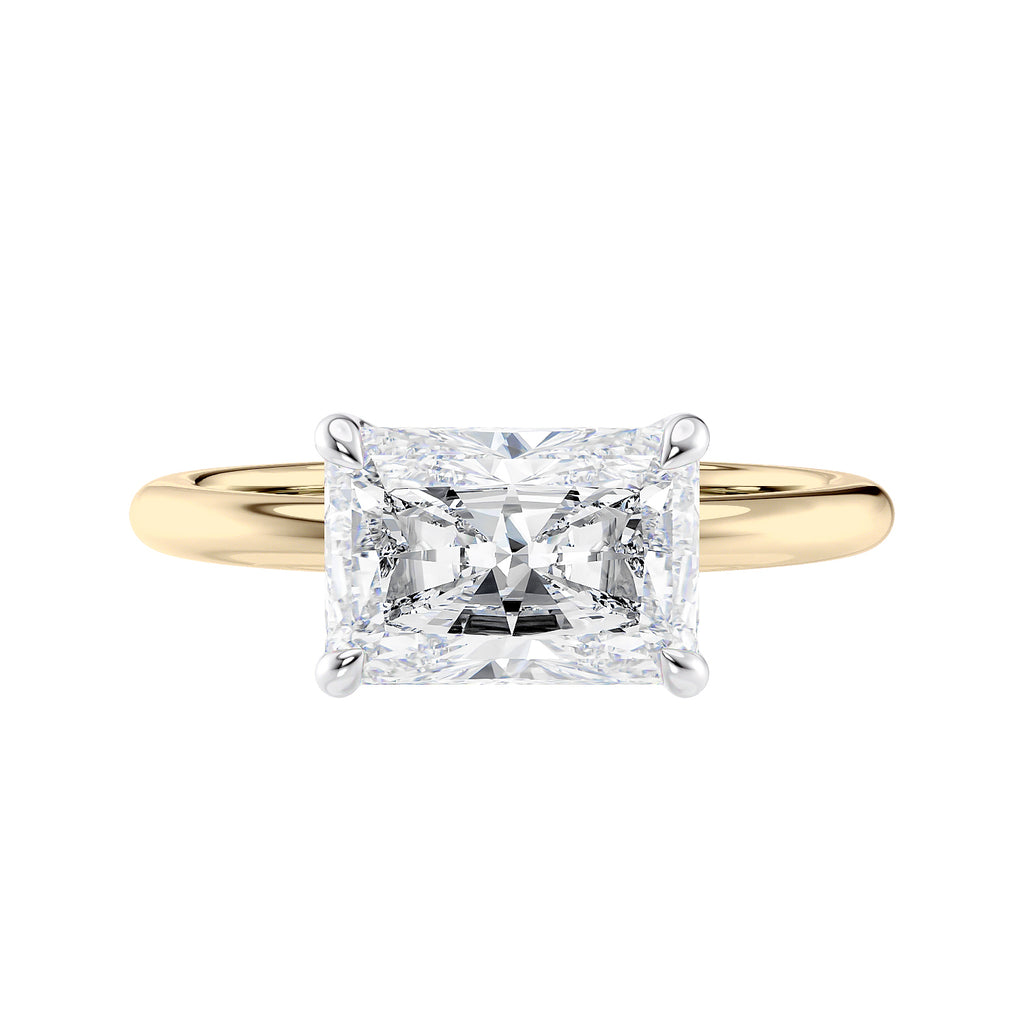 Radiant cut lab grown diamond east-west set on thin band gold front view.