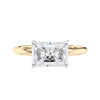 Radiant cut lab grown diamond east-west set on thin band gold front view.