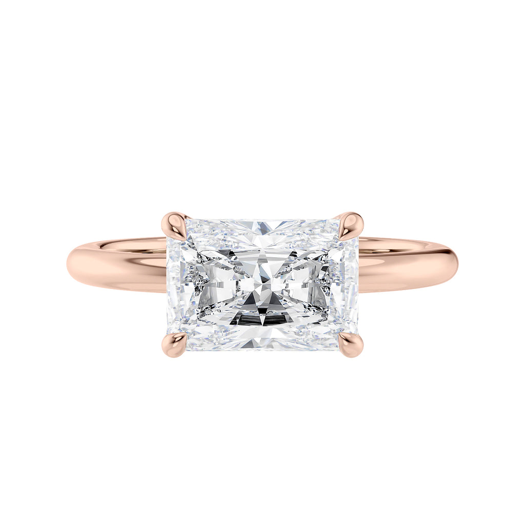 Radiant cut lab grown diamond east-west set on thin band rose gold front view.