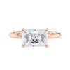 Radiant cut lab grown diamond east-west set on thin band rose gold front view.