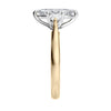 Marquise cut diamond with pear cut diamond shoulders 3 stone engagement ring gold end view.