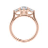 Marquise cut diamond with pear cut diamond shoulders 3 stone engagement ring rose gold side view.