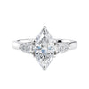 Marquise cut diamond with pear cut diamond shoulders 3 stone engagement ring white gold front view.