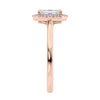 Emerald cut diamond halo style engagement ring rose gold end view.