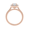Emerald cut diamond halo style engagement ring rose gold side view.