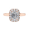 Emerald cut diamond halo style engagement ring rose gold front view.