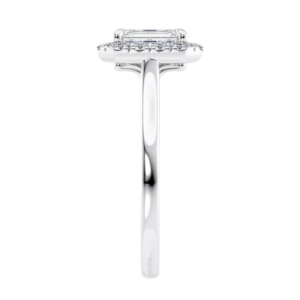 Emerald cut diamond halo style engagement ring 18ct white gold end view.