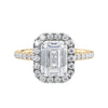 Natural diamond emerald cut halo style engagement ring 18ct gold front view.