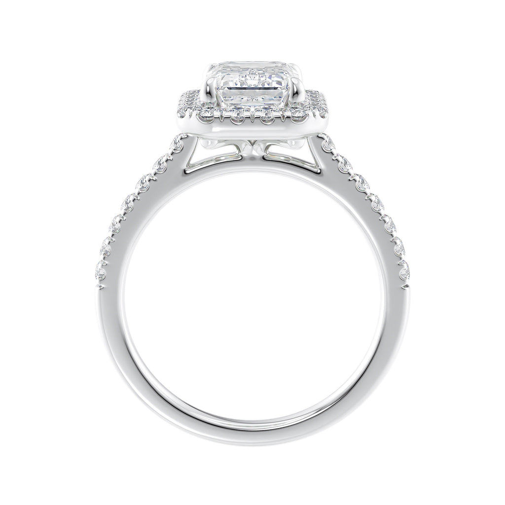 Natural diamond emerald cut halo style engagement ring white gold side view.