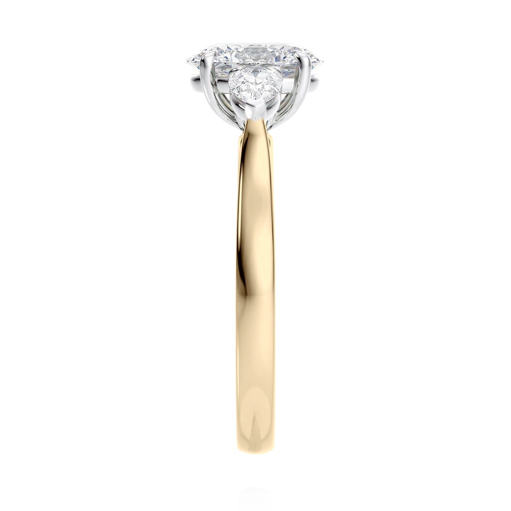 Oval 3 stone diamond engagement ring with pear side stones 18ct gold end view.