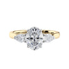 Oval 3 stone diamond engagement ring with pear side stones 18ct gold front view.