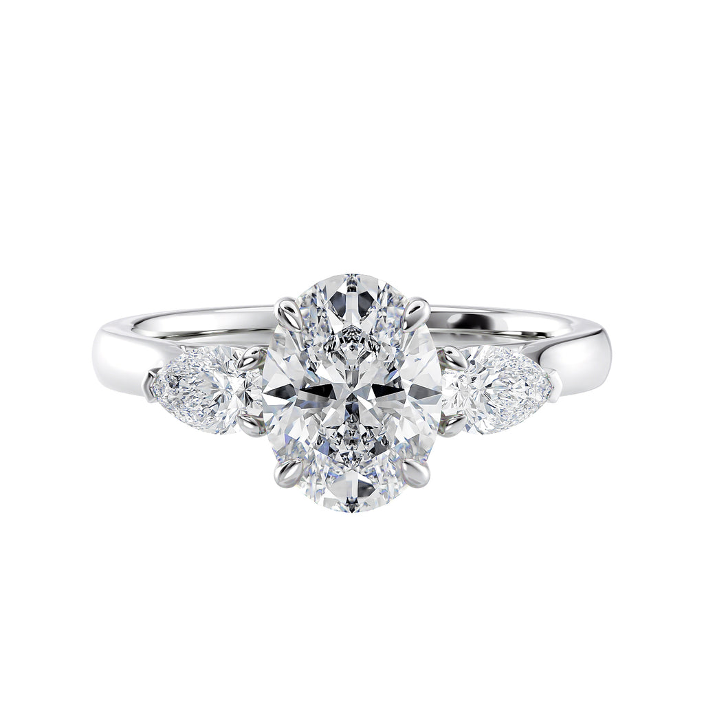 Oval 3 stone diamond engagement ring with pear side stones white gold front view.